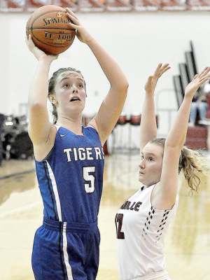 CAREER HIGH—Defended by her cousin Brady Bouchey, Olivia Dix shoots for two of her career-high 41 points in the Lady Tigers’ win over Plainville on Thursday, February 18.