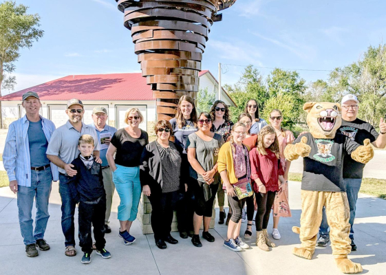 THE OGALLALA COMMONS board and staff members made stops in several places in Rooks County when they visited the area on Friday, October 8th. One stop was in Codell with them taking a picture in front of the Codell Cyclone sculpture.