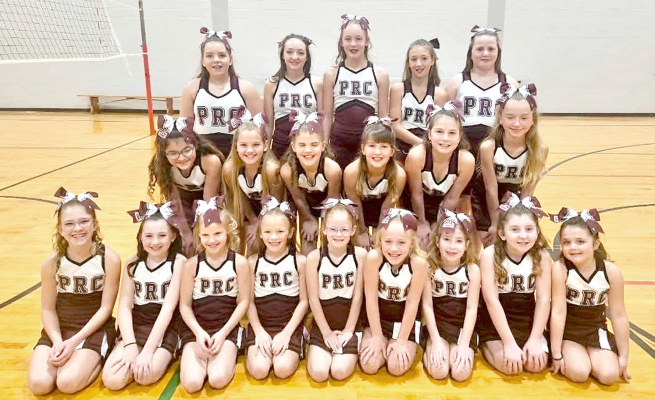 Junior Cardinal Cheerleaders perform at Fort Hays State