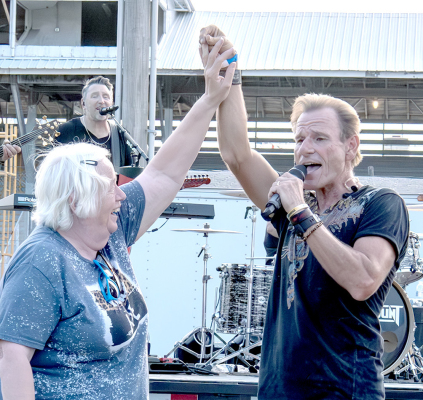 CAROLYN EARL enjoys a dance with Paramount’s Eddie Light on Saturday night of the Rooks County Free Fair.