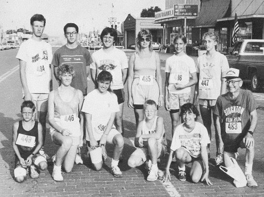 RUNNERS PARTICIPATING IN THE 2 MILE FUN RUN during the 1989 Summer Festival were (front row, from left) H.J. Colburn, Sally Thomas (Phillipsburg), Deborah Dinkel (Victoria), Christopher Whitney (Prairie View), Lou Chance, Clarence Deutscher (Ellis); (back row) Jason Gray (Alton), Erik Schmeller (Hays), Tony Bozarth, Marty Jackson (Phillipsburg, Tina Jackson (Phillipsburg) and Christi Diercks (Agra).