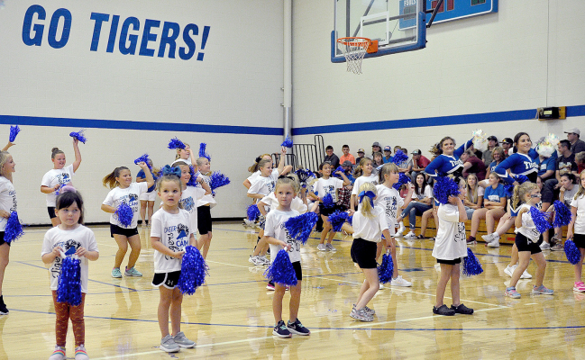 THE YOUNG CHEERLEADERS, under the direction of the SHS Cheerleaders, entertained the large group of Tiger fans at the Back to School Bash with a dance from Cheer Camp.