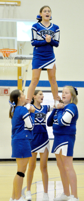 THE SJH CHEERLEADERS spread their spirit at the recent Back to School Bash. From left are: Shae Yohon, Meredith Gasper, Brenna Odle; and on top, Camille Lowry