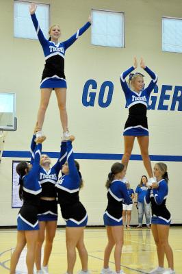 THE SHS CHEERLEADERS perform a stunt during the Tiger Nation Back To School Bash. The are, from left: Taigen Kerr, Ava Dix, Addie Struckhoff, Temprance Northup and Claire Plumer; and on top: Saj Snyder and Delanee Bedore.