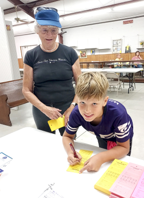 Jasiah McReynolds, son of Joel and Jennifer McReynolds of Kearney, Nebraska, enters his Lego display at this year’s Rooks County Free Fair. Here he is pictured with his grandmother, Wynn McReynolds.