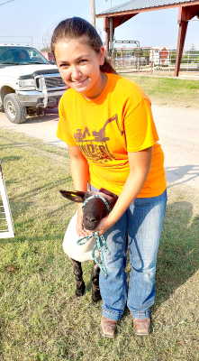 RAVEN LONG with Helpful Hands 4-H, shows off her sheep, Wayne, who was one of the many animals you could have seen at this year's Fair.