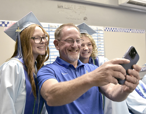 Ella Snyder, teacher Justin Basart, and Ashlyn Hahn