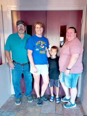 NEW LOBBY DOORS at the Nova Theatre were donated by the Joe Weidenhaft family “In Memory of Pat Weidenhaft.” The doors finally arrived and were installed this past week, making them a wonderful and functional addition to the facility. Pictured are (from left): Joe Weidenhaft, Jana Griffin, Jake Cockrell and Kelly Cockrell.