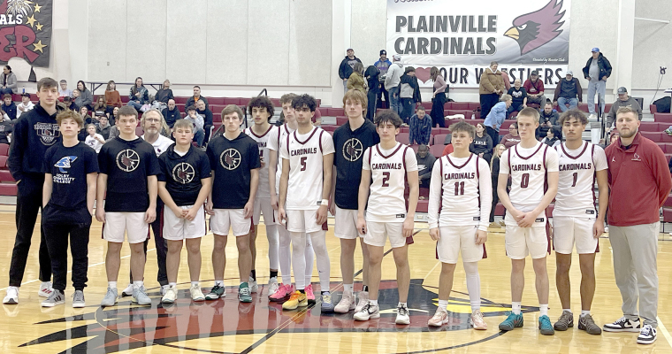 THE 2026 MID-CONTINENT LEAGUE BASKETBALL TOURNAMENT RUNNERS-UP, the Plainville Cardinals, gave the TMP Monarchs a good game on Saturday, but came up short of the title. Pictured from left are: Ben Rinehart, Quentin Maddox, Crispin Meyers, assistant coach Wade Ditter, Carson Ditter, Reid Stamper, Davyn Willeford, Riley Rogers, Ari Patel, Cayden Klein, Joey Dintino, Easton Ditter, Erik Mackey, Draden Puckett, and head coach Brent Gehring.