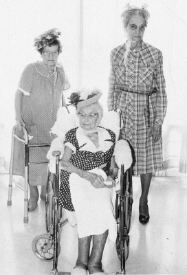 THE 1989 EASTER BONNET CONTEST WINNERS at the Solomon Valley Manor were (from left): Mayre Koontz, second place; Bea McCall, first place; and Nora Fleming, third place. The judges for the contest were Bette Locke, Becky Nicols and Connie Yakish. After the contest, the residents watched while the children attending the party took turns swinging at the candy-filled Easter Egg piñata.