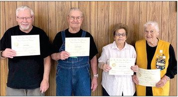 From left: Jim Paley, Stockton, six years of service; Ivan Brasted, Logan, seven years; Betty Cadoret, Stockton, 27 years; and Ferma Kahle, Logan, 21 years.