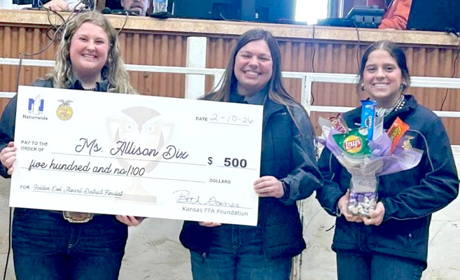 PHILLIPSBURG HIGH SCHOOL AGRICULTURE TEACHER ALLISON DIX (center) is presented with the 2026 Northwest District Golden Owl finalist award by Madi Johnson (left) of the Phillipsburg FFA and Mia Odle (right) of the Stockton FFA.
