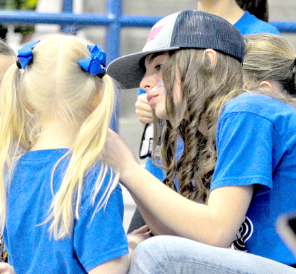 Addison Dix, right, painting face of Kitlynn Snyder