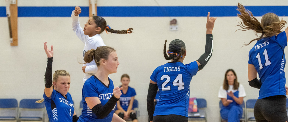 Remy Muir, Ava McCoy, Brooklyn Couse, Adrienne McCoy and Addie Dix celebrate an ace vs. Osborne JH