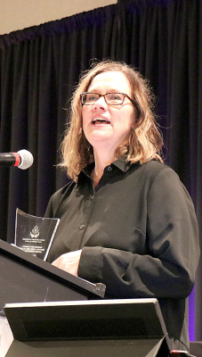 HEATHER WINKLEPLECK accepts the Kansas Prevention “Sally Zellers” Lifetime Achievement Award at the seventh annual Kansas Prevention Conference held during the first part of October.