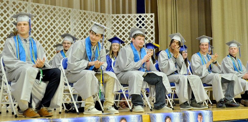 GRADUATES APPLAUDING the speech given by Mrs. Michelle Towery at Commencement last Saturday afternoon.