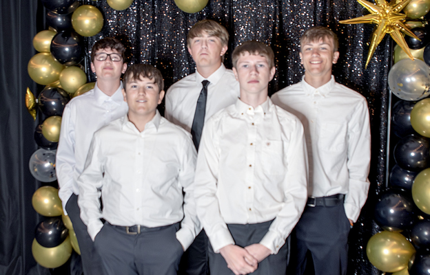 HELPING SERVE the meal provided by The Daily Grind at Stockton’s High School Prom, “A Golden Masquerade,” held on Saturday, April 18th were (from left): Tristynn St. Clair, Bentley Carpenter, Damon Muir, Lucas Earl, and Kolt Kuhlmann.