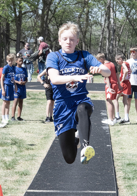 Maverick Post long jumps at the SJH Invitational