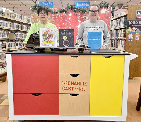 PEOPLE CAN NOW UNLEASH their culinary creativity in a fun and innovative way to explore cooking with the new Charlie Cart at the Stockton Public Library. Pictured are librarian Chris Sander and program director Sierra Reed.