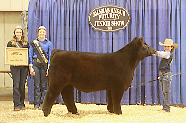 ELI ATKISSON, STOCKTON, right, showed the reserve grand champion predominantly black Angus steer at the 2024 Kansas Angus Association Futurity Junior Show, Jan. 21 in Hutchinson. (Photo by Jeff Mafi, American Angus Association)