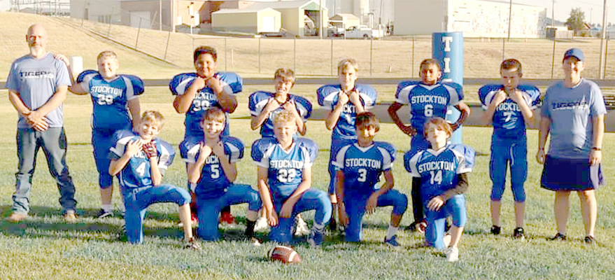 MEMBERS OF THE STOCKTON REC JUNIOR FOOTBALL TEAM are: front row, from left: Jaxen Balthazar, Eli Atkisson, Grayson Mongeau, Jefferson Creighton, and Karson Kuhlmann; and back row, from left: Coach Bryan Morgan, Jack Morgan, Kaiden Fast, Cohen Muir, Henry Berkley, Treyvon Clark, Hudson Saaranen, and Coach Mara Morgan.