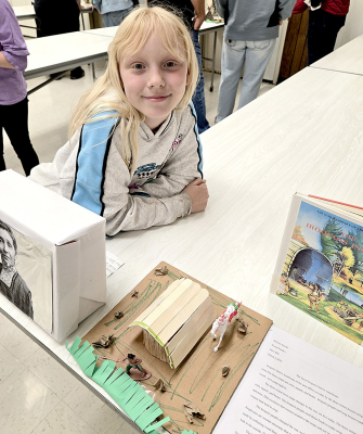 THE IROQUOIS were the topic of Kitlynn Snyder's presentation during the fourth-grade social studies program held at the Stockton lunchroom on April 2nd. The students wrote research papers, made three-dimensional models of huts, teepees, or lodges, demonstrating the construction of their homes and how they adapted to the landscape.