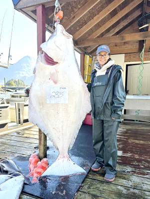 DAPHNE PLUMER OF STOCKTON is pictured with her monster halibut she caught August 6, while on a fishing trip to Pelican, Alaska.