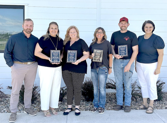 FOUR OUTGOING BOARD MEMBERS of the Heartland Community Foundation were recognized recently with a plaque for their incredible contributions while serving on the board. Pictured are, from left: Board President Josh Dreher, boardmembers Katie Dorzweiler, Kelli Hansen, Sara Brown, and Trey Moeder, and Executive Director of HCF Sarah Meitner.