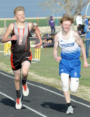 CAMERON LINDSEY, right, holds off his Sylvan-Lucas competitor down the stretch in the 1600 M Run at the Kaser Relays in Osborne, setting a new PR of 5:21.81.