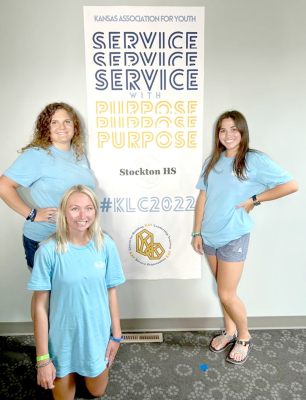 ATTENDING KAY LEADERSHIP CAMPthis July were Delanee Bedore (kneeling) Addie Struckhoff (left) and Taigen Kerr (right). The ladies represented Stockton High School and brought home ideas and projects for the organization to implement this coming school year.