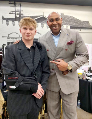 SHS JUNIOR ISAAC THAYER, pictured with Shark Tank winner, Cedric Cobb, earned the Most Sustainable Business Award at the Kansas State Youth Entrepreneurship Competition for his business proposal, IT Timeless.