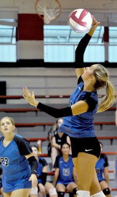 Breckyn Williams spiking, with Brin Muir, vs. Natoma