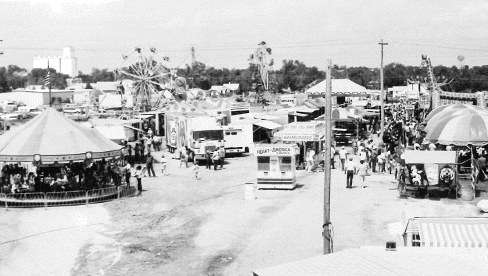 THIS AERIAL PHOTOGRAPH, captured from the top of the grandstand at the Carnival Midway of the Rooks County Free Fair, dates back to the early 1960s. Who is excited to enjoy the rides, indulge in fair food, and catch up with friends at this year’s fair?