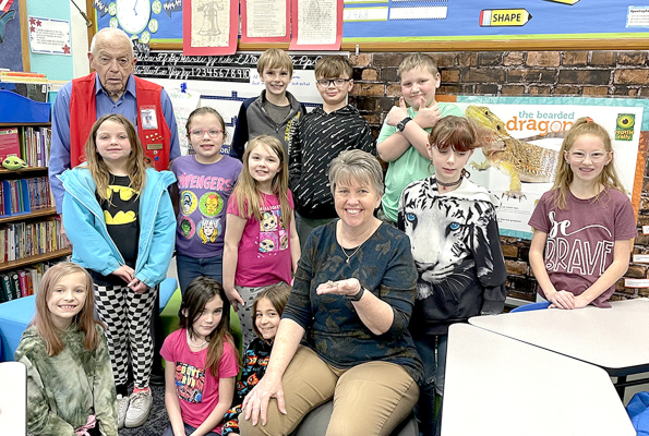 MARTHA FLECK’S THIRD-GRADE STUDENTS enjoy the aspects of having a classroom pet. They are learning how to take care of Lil’ Bug and the cost of owning a pet.