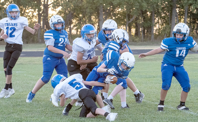Hudson Kriley runs the ball vs. Tescott JH; Other Tigers in on the play are from left: Garrison Mongeau, Hudson Muir, Lane Muir and Bentley Carpenter.