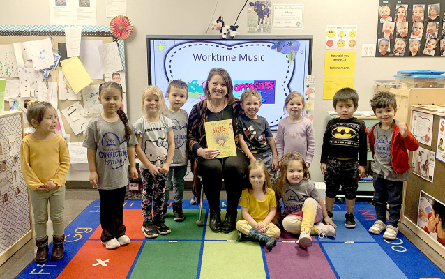 DONNA HUDSON-HAMILTON, retiring Early Childhood Center director, with a classroom of children. (Courtesy Photo)