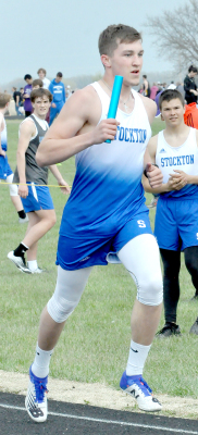 SENIOR DEYTON BEDORE runs the third leg of the 4 x 800 M Relay which placed third at the Kaser Relays held in Osborne with a season best time of 9:38.48.