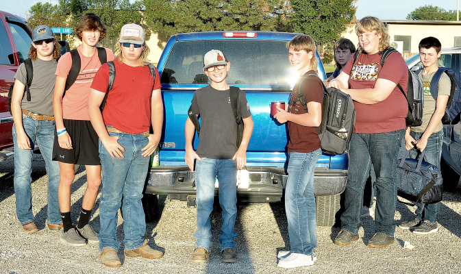 EMERSON LOWRY, MAX MOFFET, Kayden King, Beckem Hilbrink, Hayden Hilbrink, Tanner Inglsbee, Taylor Inglsbee and Cameron Balthazor hang out in the school parking lot on the first day of school.