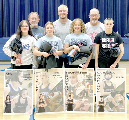 A SENDOFF WAS HELD ON FEBRUARY 26 at Stockton High School for the four wrestlers who qualified for the state wrestling tournament held in Hays. Mia Odle , Saj Snyder, Temprance Northup and Carolina Northup are pictured with their coaches Justin Basart, Deyton Bedore and Clint Bedore shortly before heading south with a police escort. Carolina went on to earn a fifth-place medal, while Saj brought home a sixth-place medal.