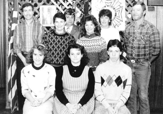 THE 1989 VOD WINNERS were recognized at the Stockton VFW Post 8873. Shown are (front row, from left): LeAnn Zachary, first place; Darla Hrabe, second place; Chris Kaba, third place; (middle row) contest judge Diedre Moore, contest judge Pam Hageman; (back row) high school speech teacher Ken Arnold, VOD VFW Chairman Everett Lowry, Ladies Auxiliary VOD Chairman Linda Hagan, and Stockton VFW Commander Paul Conger.
