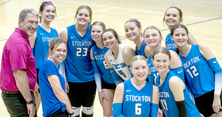 REGIONAL CHAMPIONS! The Stockton Lady Tigers were all smiles during Regional action at Stockton in October. From left are: Assistant coach Clint Bedore, Aubrey Kesler, head coach Jen Kesler, Brin Muir, Katlyn Couse, Bodye Stithem, Ava Dix, Saj Snyder, Ashlyn Hahn, Teagann Shamburg, ShaeYohon, and Meredith Gasper.
