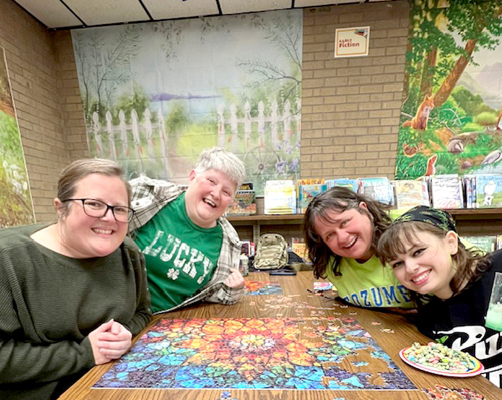 CHAMPIONSHIP PUZZLE TEAM of Deidre McNamee, Judy Shooltz, Tracy Dinkel, and Emma Dinkel.