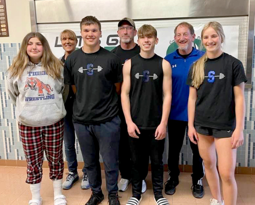 TIGER POWERLIFTERS, along with their coaches, who competed at the state powerlifting meet were, from left: Rivver Long, Coach Janet Kuhlmann, Zach Young, Coach Clint Bedore, Cason Iwanski, Coach Justin Basart, and Ava Dix. (Courtesy Photo)