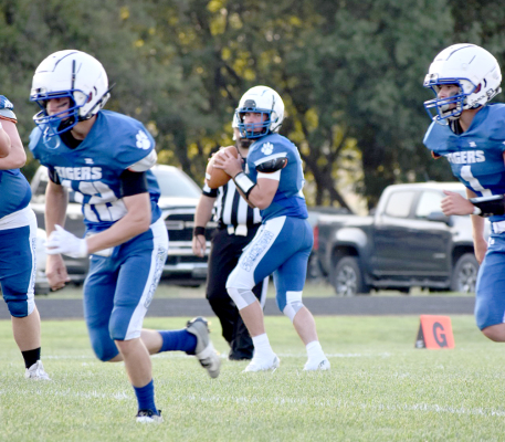 Cameron Balthazor (#12), Emerson Lowry (QB) and Jace Kesler (#1) vs. Logan/Palco