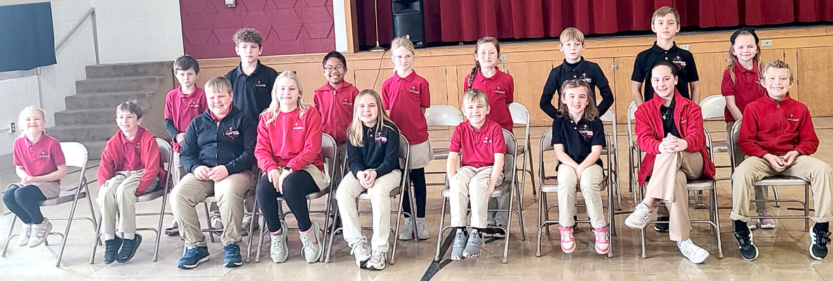 COMPETING in the Sacred Heart Spelling Bee on Tuesday, January 27th, as part of Catholic Schools Week were (front row, from left) Jayme Whisman, Logan Nuttle, Max Brewster, Raya Kuhlmann, Ruthie Brewster, Jack Brewster, Charlie Belzer, Annabella Hrabe, Jack Hillard; (back row, from left) Wesley Pfannenstiel, Blake Nuttle, Jesse Akoh, Hallee Becker, Jessah Slaubaugh, Blake Hrabe, Wyatt Belzer, and Brenna David. (Courtesy Photo)