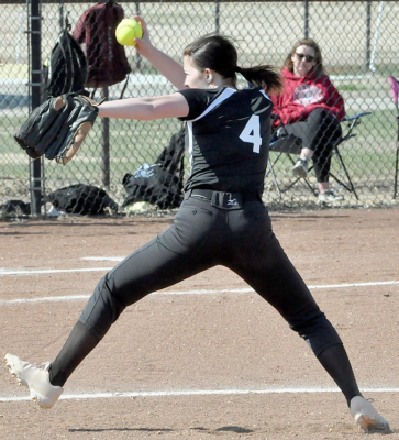 STOCKTON SOPHOMORE CORYN HAHN throws a strike during softball action between the Rooks County girls and the Ellis Railroaders last Thursday in Plainville.