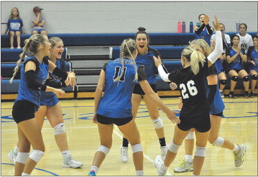 Lady Tigers celebrate a point vs. Tescott