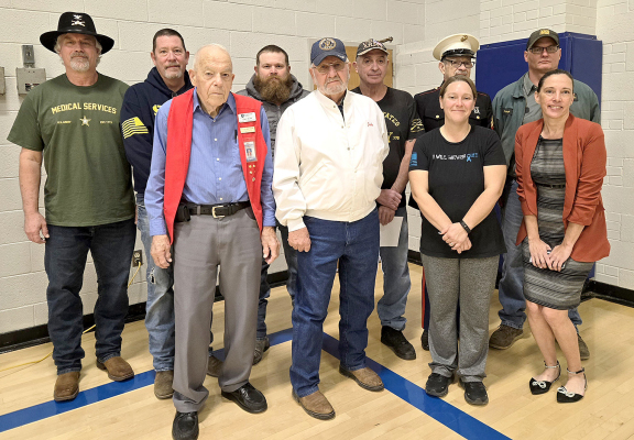 VETERANS who were honored at the Stockton High SchoolVeterans Day Program on Monday, November 11th were (front row, from left) Glen Buss, Robert Miller, Mara Morgan, Dr. Angela McCollum; (back row) Dr. Anthony Cole, Tim Johnston, Patrick Bretton, Ed Thayer, Dave Denton, and Shayn Balthazor.