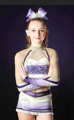 RAEGAN JONES beams with pride in her Lady Dynasty cheer uniform during the Valley of the Sun Winter Championship in Mesa, Arizona, January 2026.