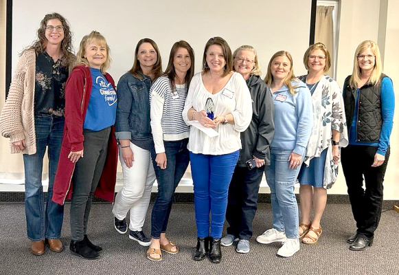 STAFF FROM EARLY CHILDHOOD CONNECTIONS IN HAYS traveling to Salina for the surprise presentation of the Kansas State Children’s Champion Award, given this year to Donna Hudson-Hamilton, included: from left, Christine Weber, Sharon Beougher, Karla Bixenman, Arielle Simpson, Donna, Brenda Raven, Beth Hansen, Brenda Urban, and Michelle Dannels.